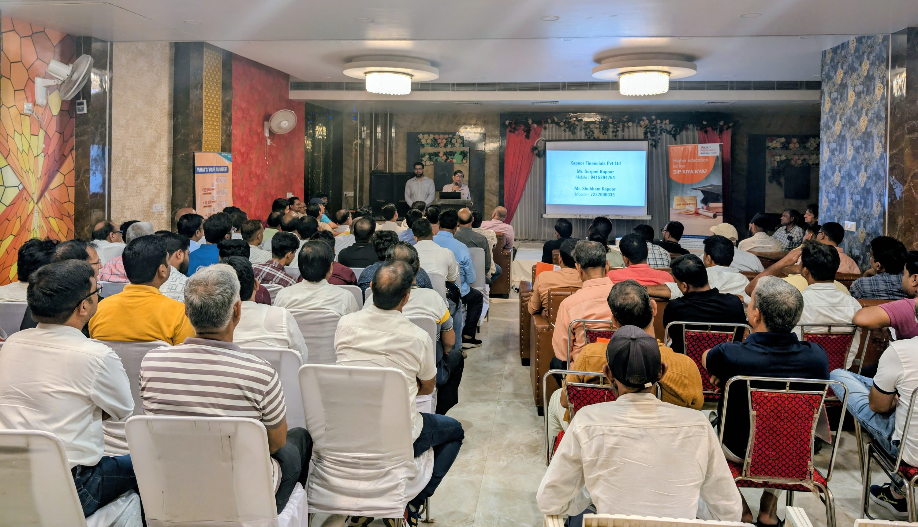 Surjeet Kapoor addressing an audience in Jaunpur with Devesh Trivedi of ICICI Prudential AMC beside him