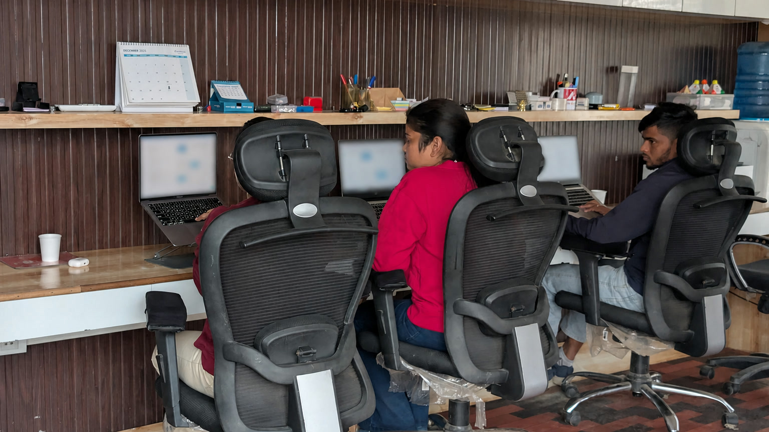 Kapoor Financials operations employees working at their computers in the Jaunpur office